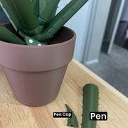 Whether placed on a desk, shelf, or any other space, this 3D printed aloe plant adds a touch of greenery and elegance to any environment. It serves as a decorative piece while also providing a practical solution for writing or taking notes. With its removable stems that double as pens, this unique creation seamlessly blends art and functionality in a delightful way.